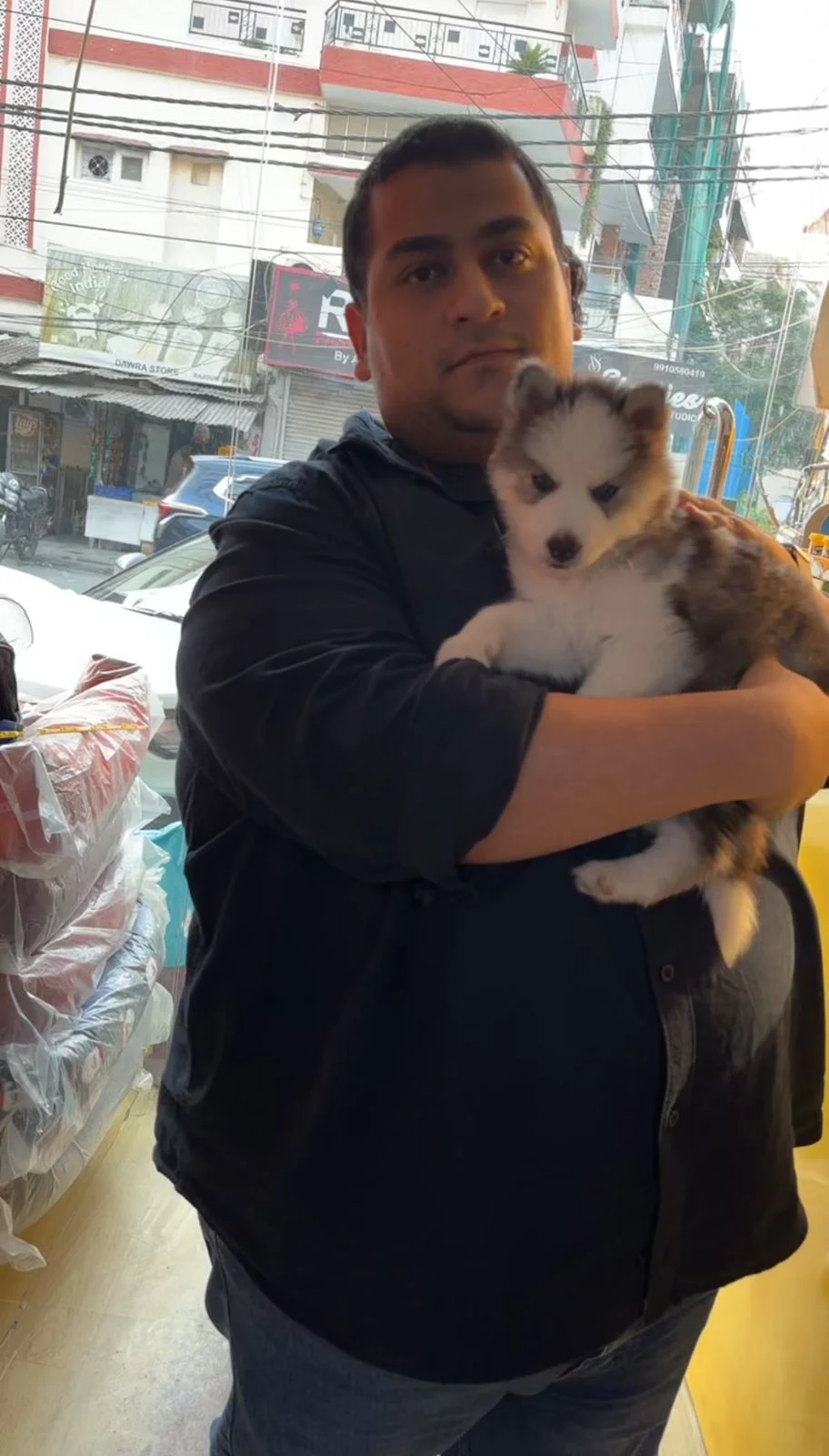 Happy customer with puppy at Kyra Pet Shop